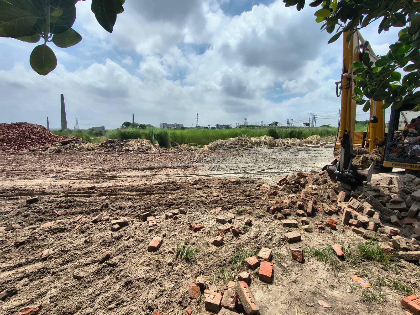 Excavator and truck on new road